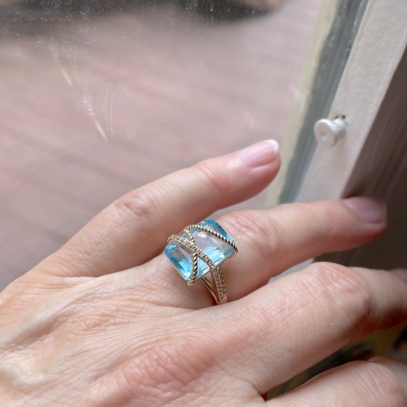 Sky Blue Topaz and Diamond Crisscross Ring in 14kt Yellow Gold. - Picture 5 of 8